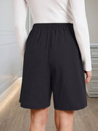 High-waisted Pleated Shorts Button Detail (5)