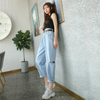 High-Waisted Ripped Jeans