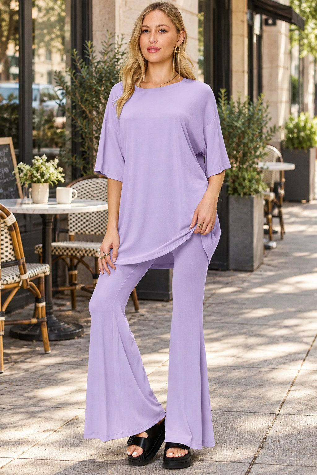 Full Size Round Neck Drop Shoulder T-shirt Flare Pants Set styled on a model