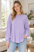 Full Size Ribbed Round Neck Long Sleeve T-shirt styled on a model