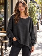 Slit Round Neck Dropped Shoulder T-shirt styled on a model