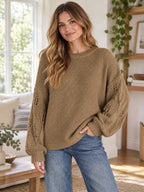 Textured Knit Openwork Dropped Shoulder Sweater styled on a model